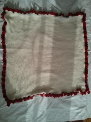 The white and red baby blanket it all its beauty